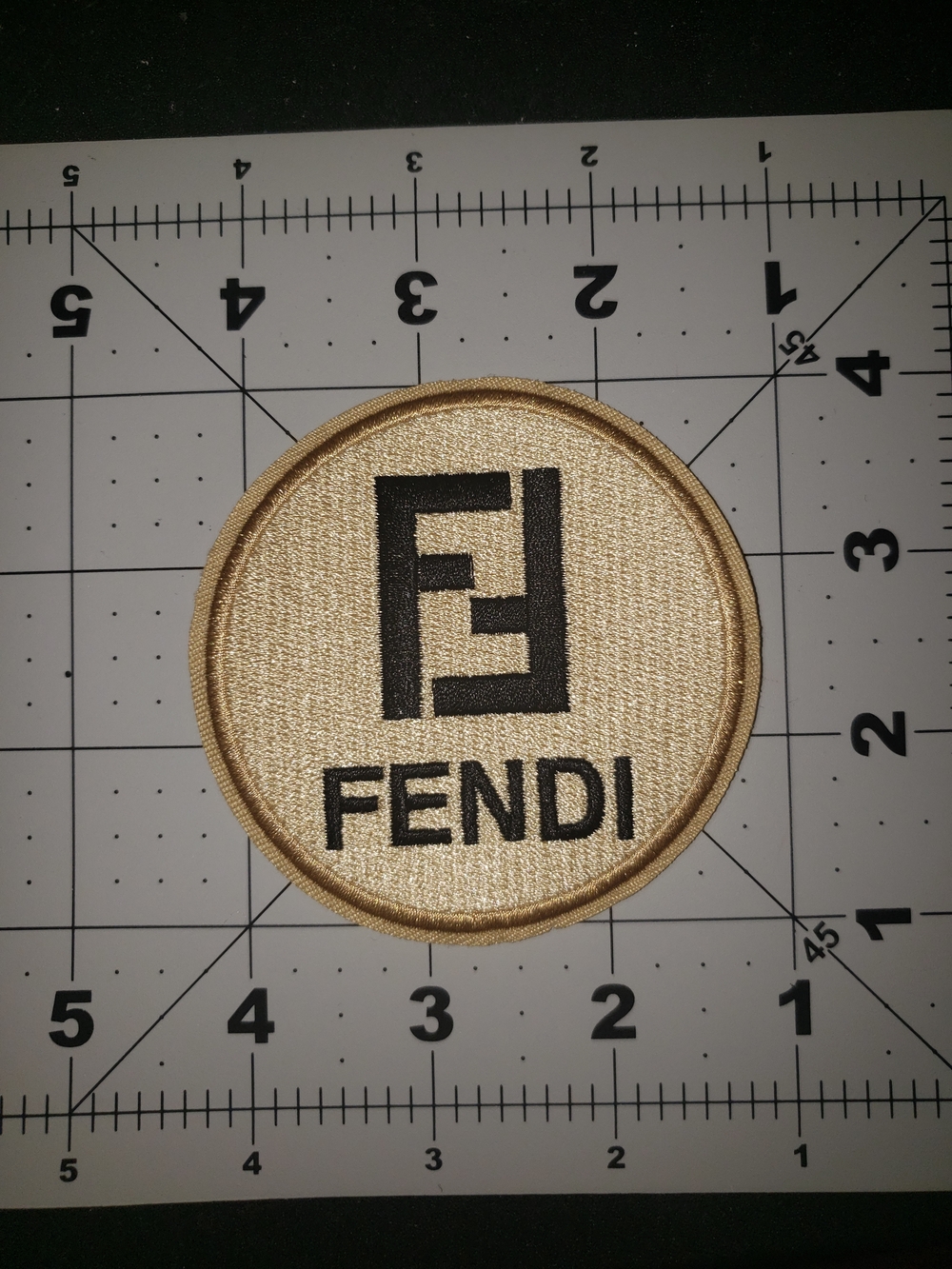 Fendi Embroidered Logo Patch in Gold and Black